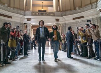 SAG Awards: “Chicago 7” and “The Crown” Lead the Way Sacha Baron Cohen and Jeremy Strong in "The Trial of the Chicago 7"